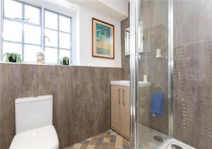 a bathroom with a toilet and a shower at Corve Cottage Historic cottage in beautiful ludlow in Ludlow