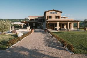 a brick walkway in front of a house at Moresco Agriturismo in Moresco