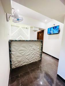 TV a/nebo společenská místnost v ubytování Hotel Hilton Suites + 17 fotografií