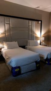 Кровать или кровати в номере Al Salam Grand Hotel