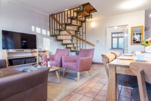 Televiisor ja/või meelelahutuskeskus majutusasutuses Ferienhaussiedlung Strandperlen Buchenhof 2a (Typ VIII)