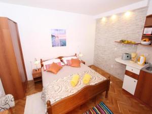 Postel nebo postele na pokoji v ubytování Apartments Frane