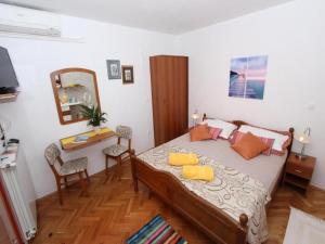 Postel nebo postele na pokoji v ubytování Apartments Frane