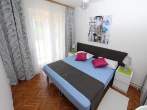 Postel nebo postele na pokoji v ubytování Apartments Frane