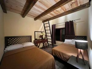 Ένα ή περισσότερα κρεβάτια σε δωμάτιο στο Cabaña No.8 Puerta del Bosque Mazamitla.