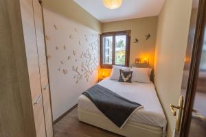 Katil atau katil-katil dalam bilik di Apartament el Cabirol