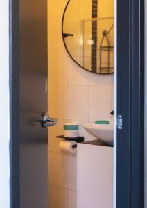 a bathroom with a sink and a mirror at Roamer St Kilda - formerly Selina St Kilda Melbourne in Melbourne