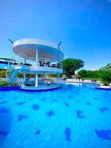 a water slide in a swimming pool at Hotel Parque la Casona in Garzón