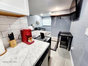 a kitchen and living room with a counter top at Studio 3! in Lakeland