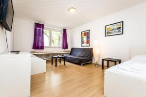 Televisor o centre d'entreteniment de WelcomeCologne Apartments