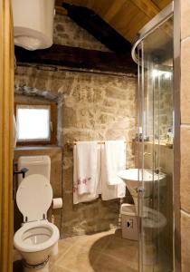 a bathroom with a toilet and a sink at Bosnian National Monument Muslibegovic House in Mostar +16 photos