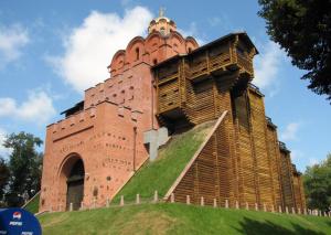 a large brick building on top of a hill at Sunday Apart Hotel in Kyiv