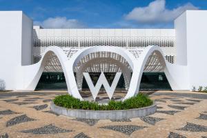 a white building with a w monument in front of it at W Algarve in Albufeira