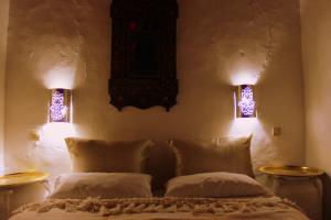 Postelja oz. postelje v sobi nastanitve Hotel Riad Dalia Tetouan