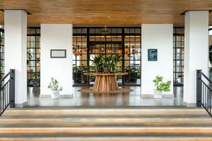 a hallway with a table in the middle of a building at Ciêla, Lusaka, a Tribute Portfolio Resort and Spa in Lusaka