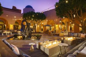 a courtyard with tables and chairs in a building at The Westin Rancho Mirage Golf Resort & Spa in Rancho Mirage