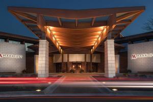 a building with a large wooden roof at night at Lincolnshire Marriott Resort in Lincolnshire