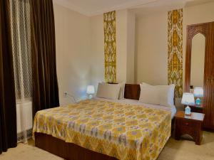 Ένα ή περισσότερα κρεβάτια σε δωμάτιο στο Saidkasim with a Terrace +60 φωτογραφίες