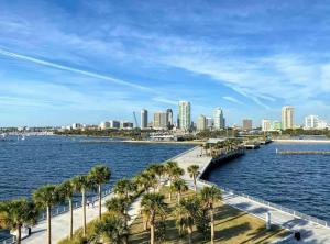 a city with palm trees and a body of water at The Hipster Studio in DTSP in St Petersburg