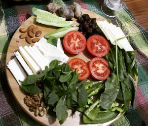 a plate of food with tomatoes and vegetables on a table at Ali Bey Konagi in Gaziantep