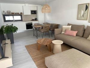 a living room with a couch and a table at AD apartment in La Oliva