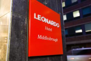 a red sign on the side of a building at Leonardo Hotel Middlesbrough in Middlesbrough +17 photos