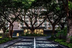 a road in front of a building with trees at The Westin Maui Resort & Spa, Ka'anapali in Lahaina