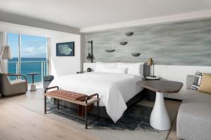 a bedroom with a large bed and a large window at The Westin Maui Resort & Spa, Ka'anapali in Lahaina