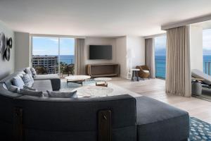 a living room with a couch and a tv at The Westin Maui Resort & Spa, Ka'anapali in Lahaina
