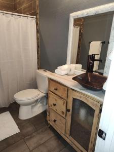 a bathroom with a toilet and a sink at Location, Location middle of downtown with private parking! in Phoenix
