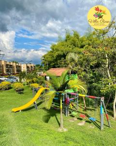 a playground with a slide in a park at Apartasol Villa Rosa, Reserva de la Colina, La Tebaida, Quindio in La Tebaida