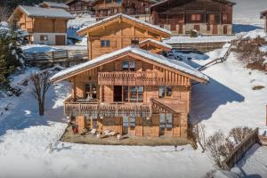 an overhead view of a log cabin in the snow at Chalet Aravista - OVO Network in Le Grand-Bornand