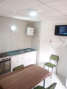 Una cocina o kitchenette en Departamentos Gattelli