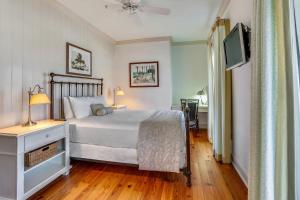 En eller flere senge i et værelse på Beach Front 3 Bedroom B