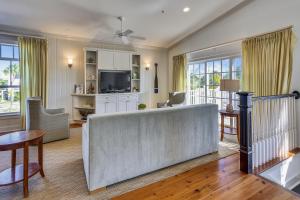 a living room with a couch and a tv at Townhouse 3 Bedroom B in Holmes Beach