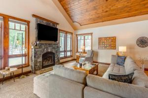 a living room with a couch and a fireplace at Pine Place in Kalispell