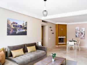 a living room with a couch and a table at New Modern Apartment in Marrakech - Netflix - WiFi in Marrakesh