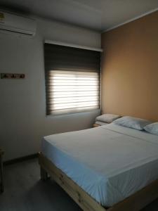 Postel nebo postele na pokoji v ubytování Hotel 42 Avenida