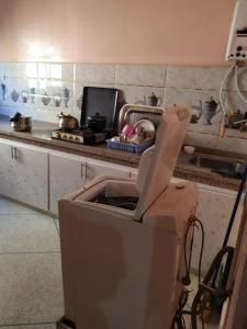 a kitchen with a sink in the middle of a counter at Logement entier appartement in Erfoud