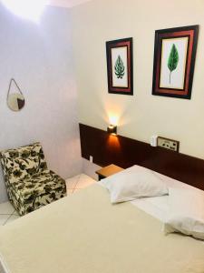 Postel nebo postele na pokoji v ubytování Hotel de Minas