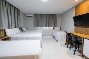 Postel nebo postele na pokoji v ubytování Hotel Solar Paulista
