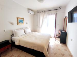 Katil atau katil-katil dalam bilik di Syrtaki Hotel