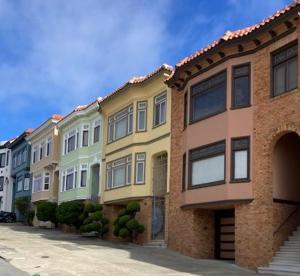 a row of houses on the side of a street at Beautiful Edwardian Victorian Homestay B&B in San Francisco