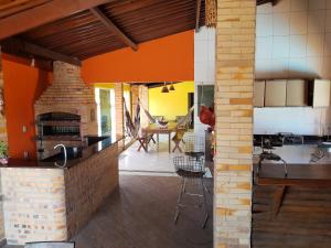 a kitchen and living room with an open floor plan at Casa Recanto do sol in Natal