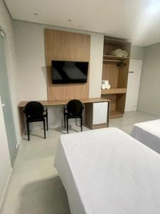 TV a/nebo společenská místnost v ubytování Hotel Solar Paulista