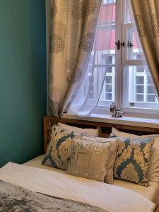 Posteľ alebo postele v izbe v ubytovaní APARTAMENTY-MI PLAC ZAMKOWY