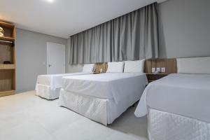 Postel nebo postele na pokoji v ubytování Hotel Solar Paulista