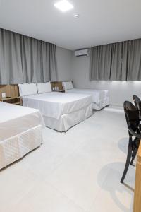 Postel nebo postele na pokoji v ubytování Hotel Solar Paulista