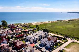 an aerial view of a town next to the ocean at Rewa Park in Rewa