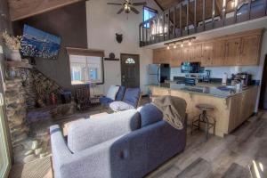 a living room with a couch and a kitchen at Bigler Bonus condo in Stateline
